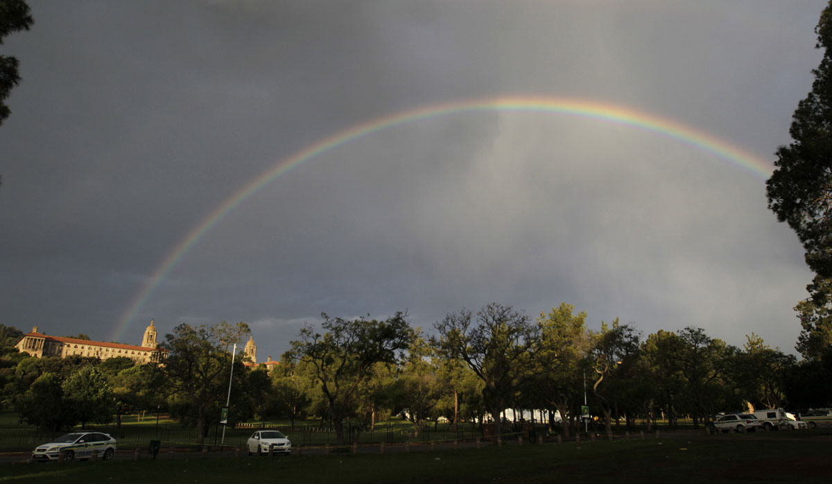 A rainbow is seen over the Union Building, where the body of Nelson Mandela was lying in state, in Pretoria